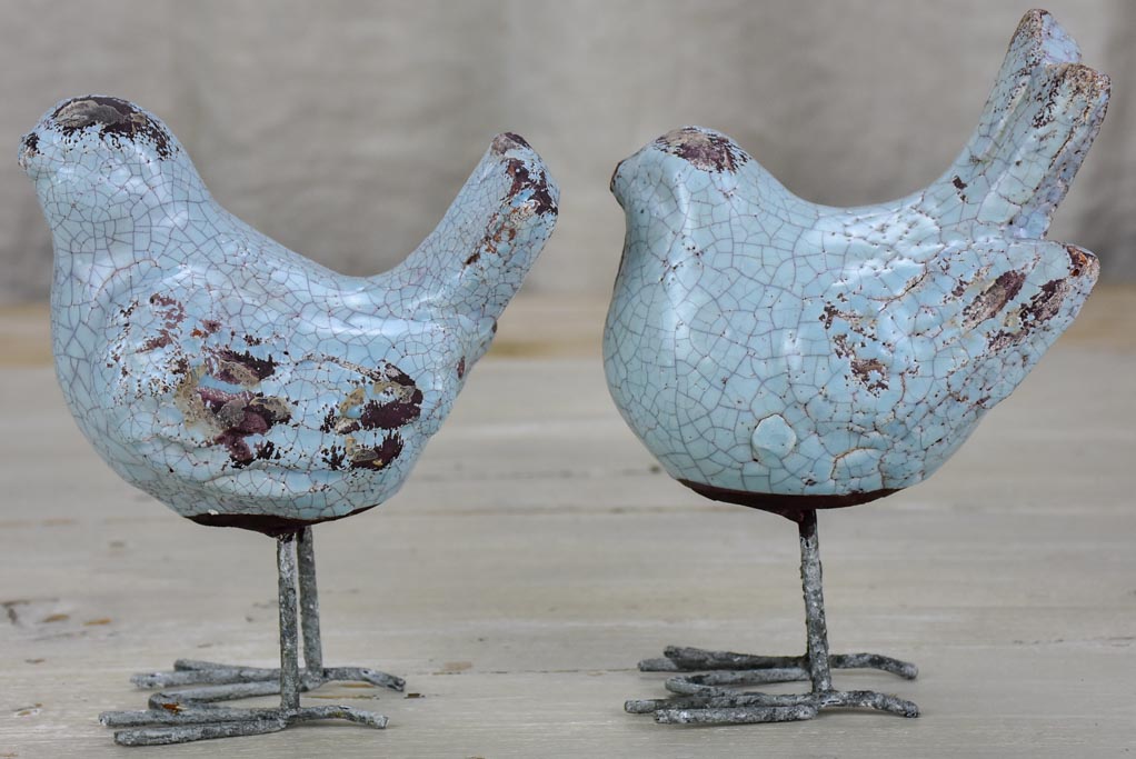 Two artisan made bird sculptures