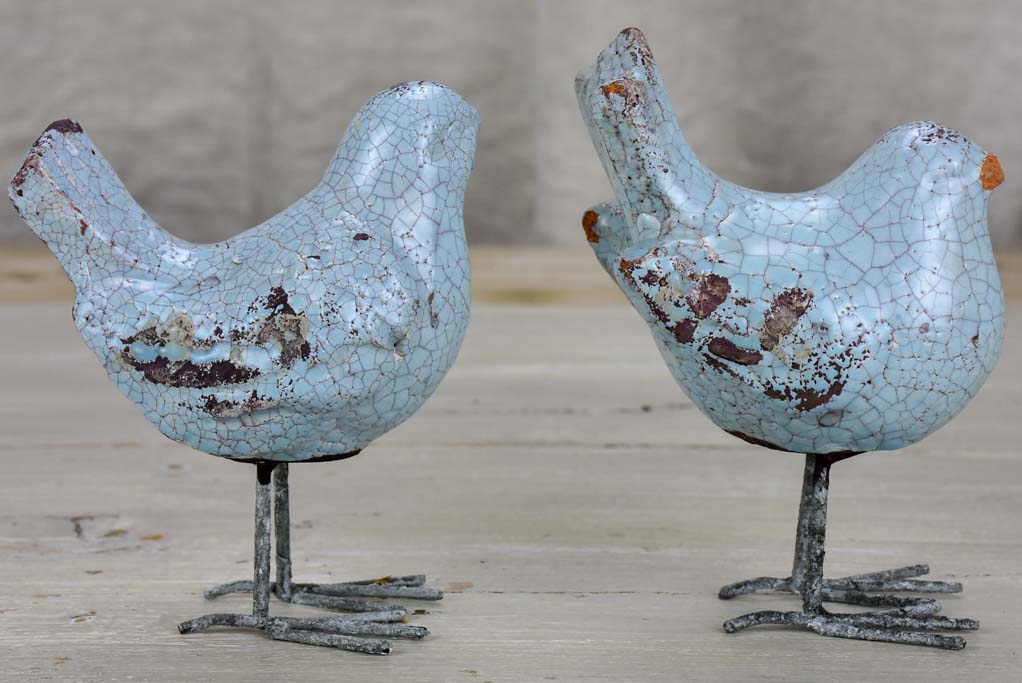 Two artisan made bird sculptures