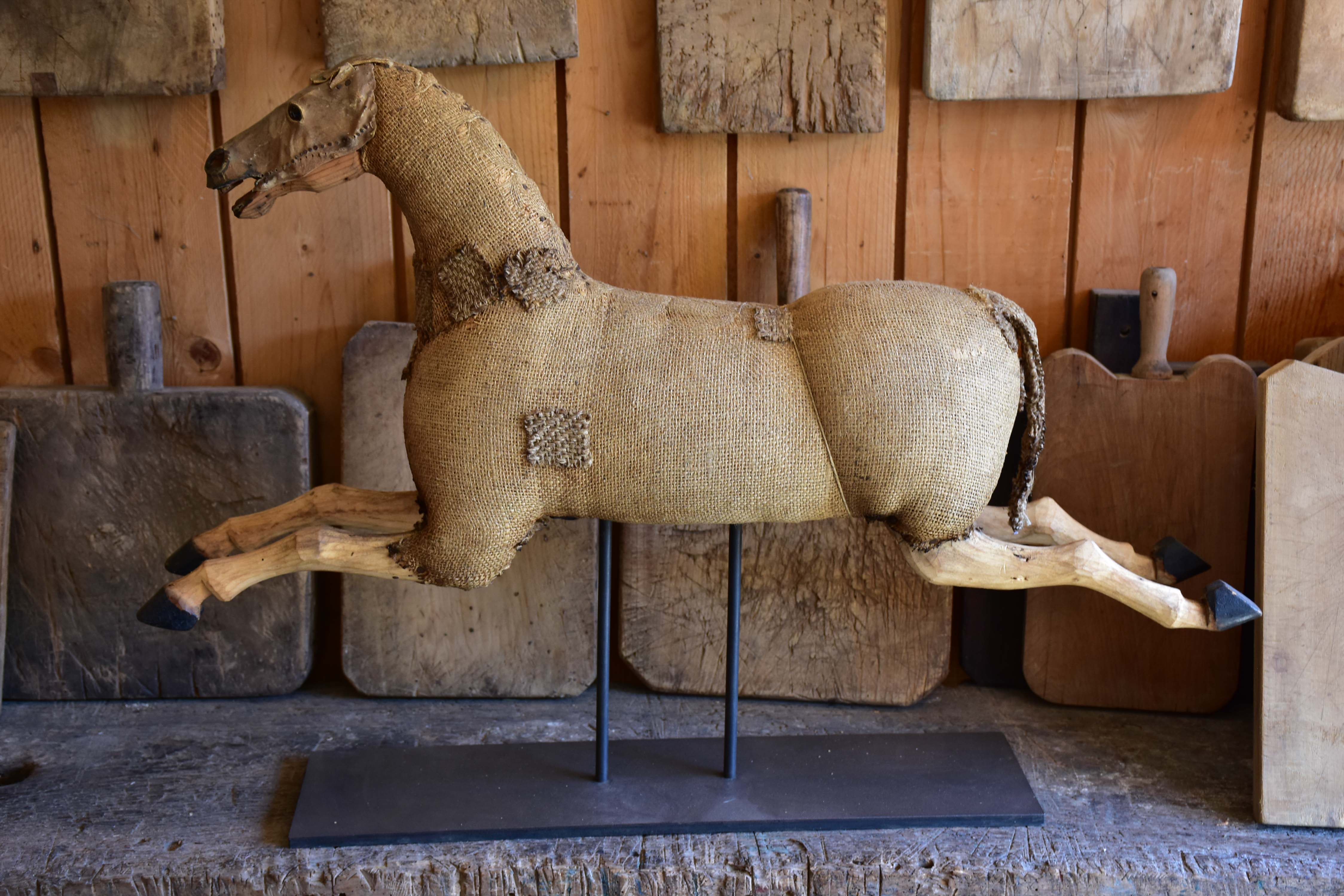 Antique French toy horse mounted on a stand