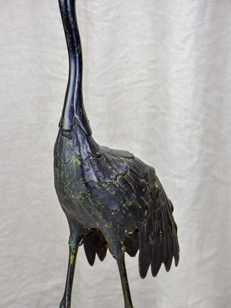 Two vintage garden sculptures of ibis