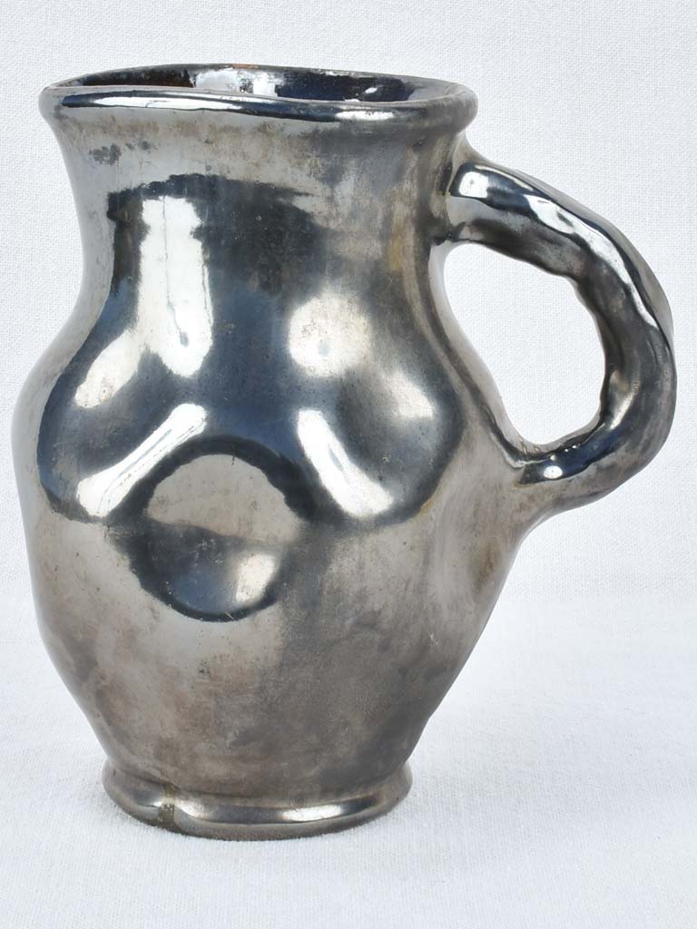 Vintage ceramic pitcher with black glaze