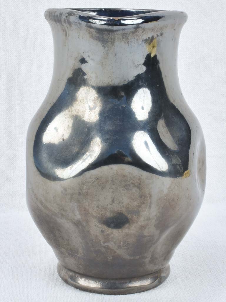 Vintage ceramic pitcher with black glaze