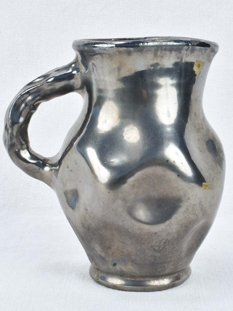 Vintage ceramic pitcher with black glaze