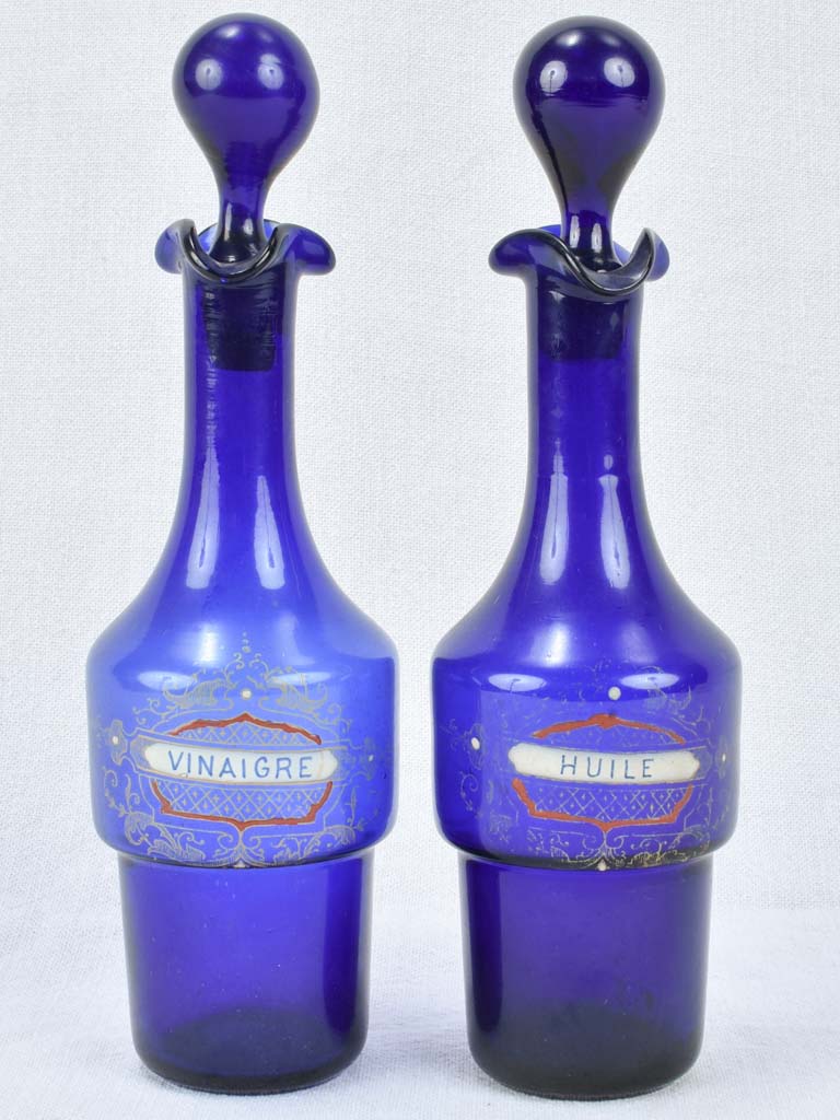 Blue glass oil and vinegar carafes 10¾"