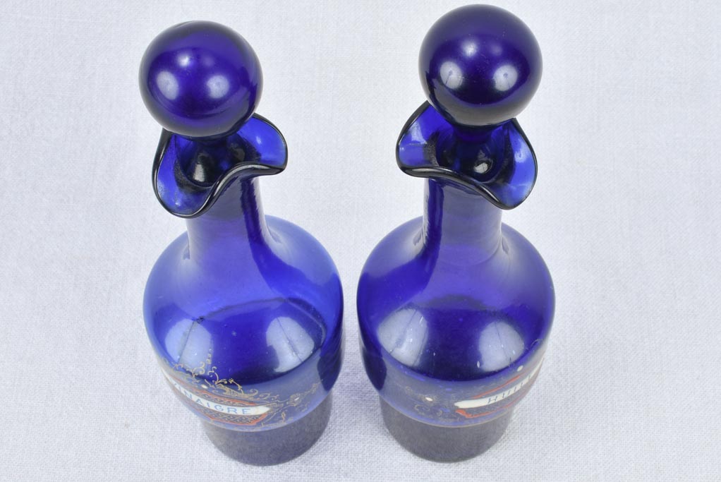 Blue glass oil and vinegar carafes 10¾"