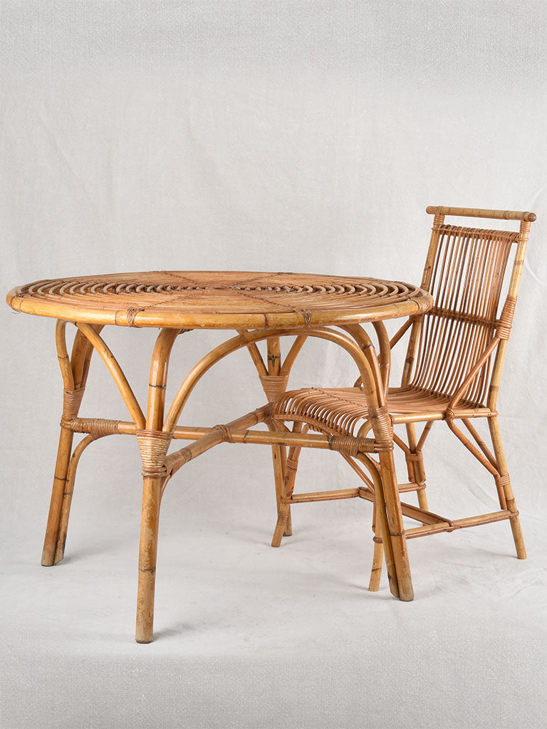 Vintage rattan table with four chairs