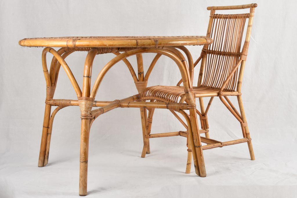 Vintage rattan table with four chairs