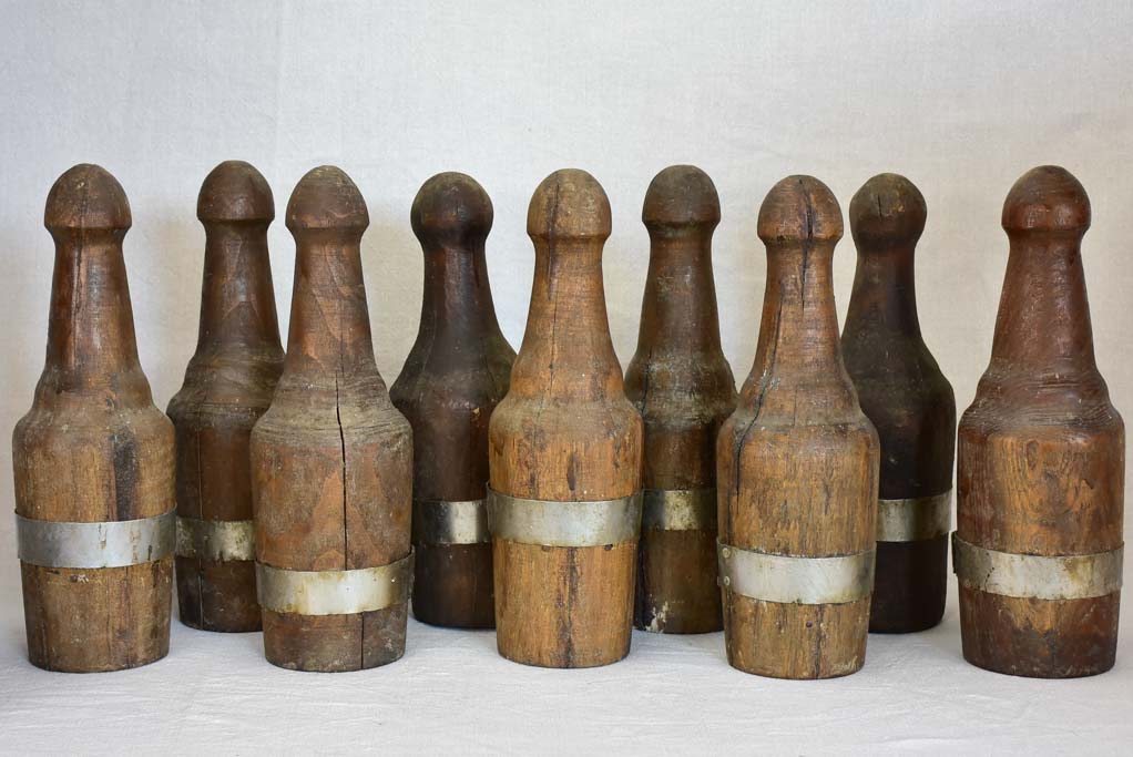 Collection of 9 carved walnut bowling skittles and ball - 19th century 15¼"