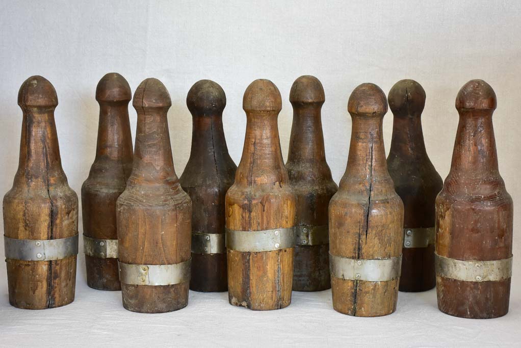 Collection of 9 carved walnut bowling skittles and ball - 19th century 15¼"