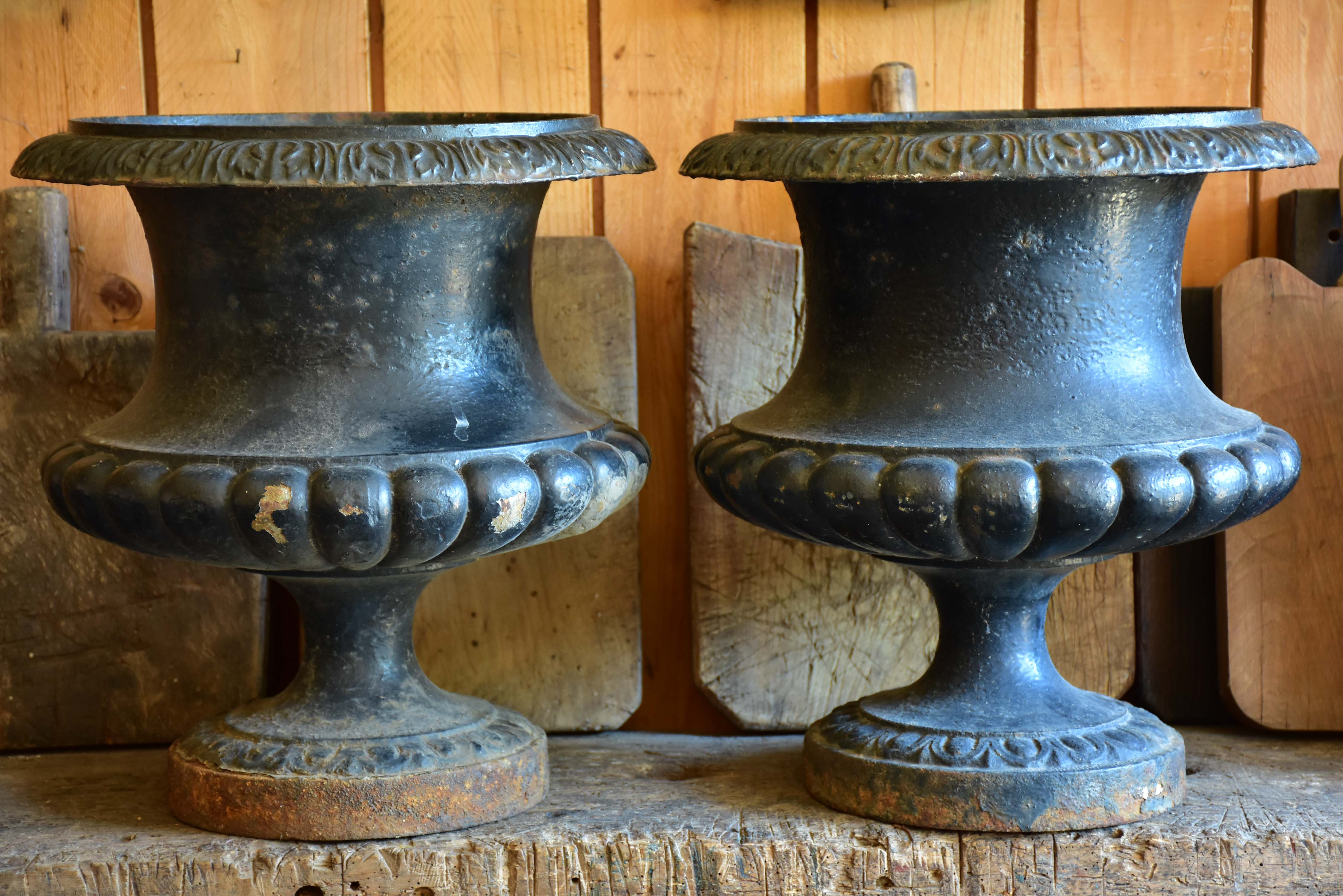 Pair of black antique French garden urns