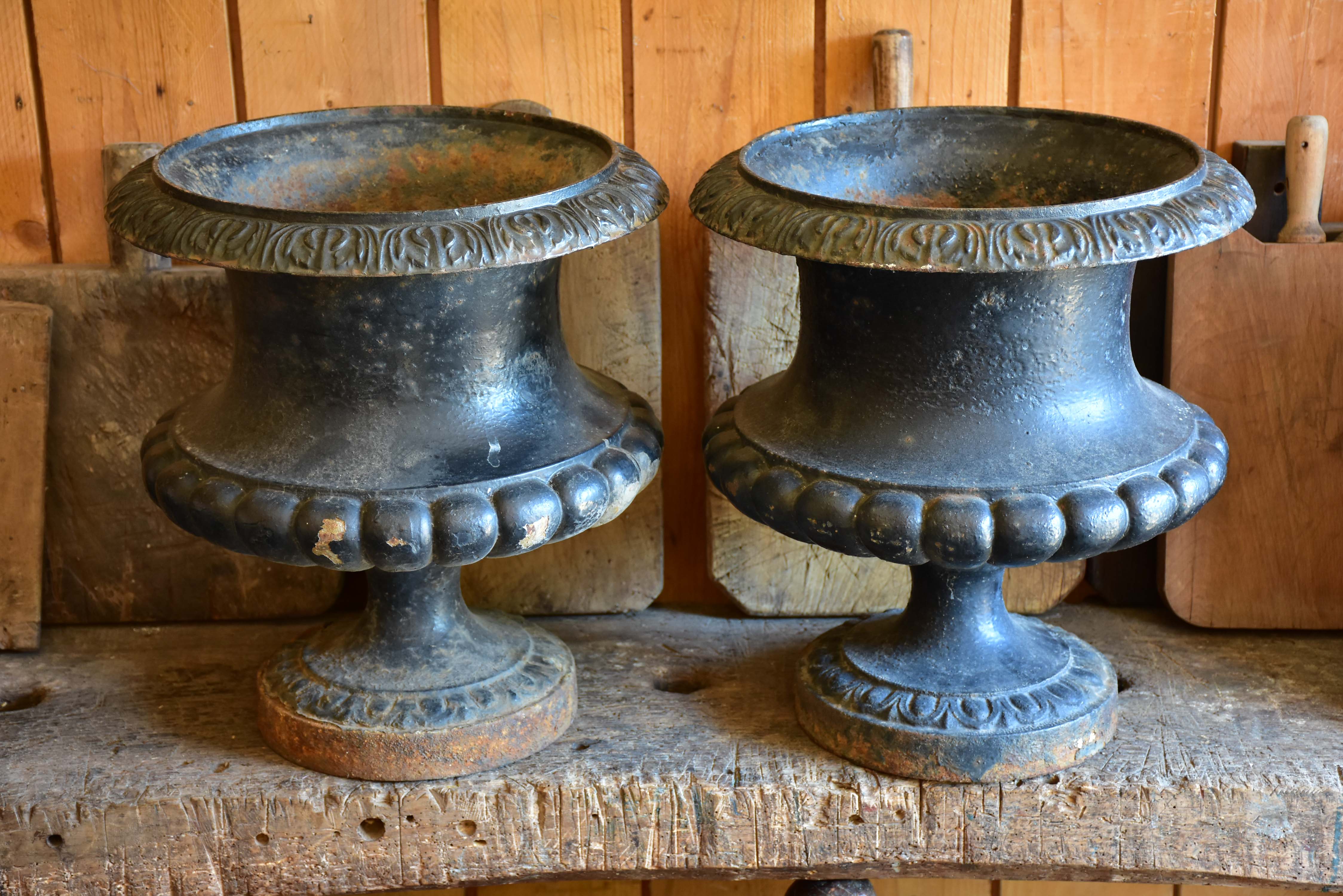 Pair of black antique French garden urns