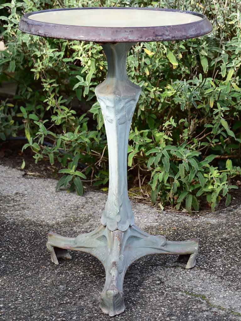 Art Nouveau cast iron bistro table with beige glass table top