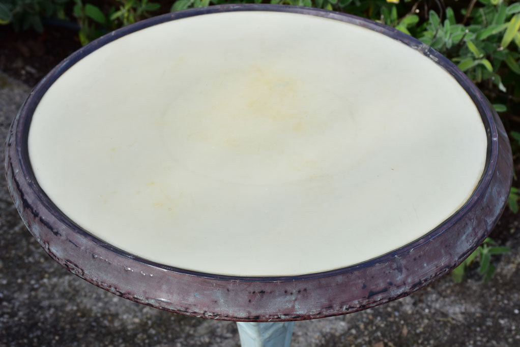 Art Nouveau cast iron bistro table with beige glass table top