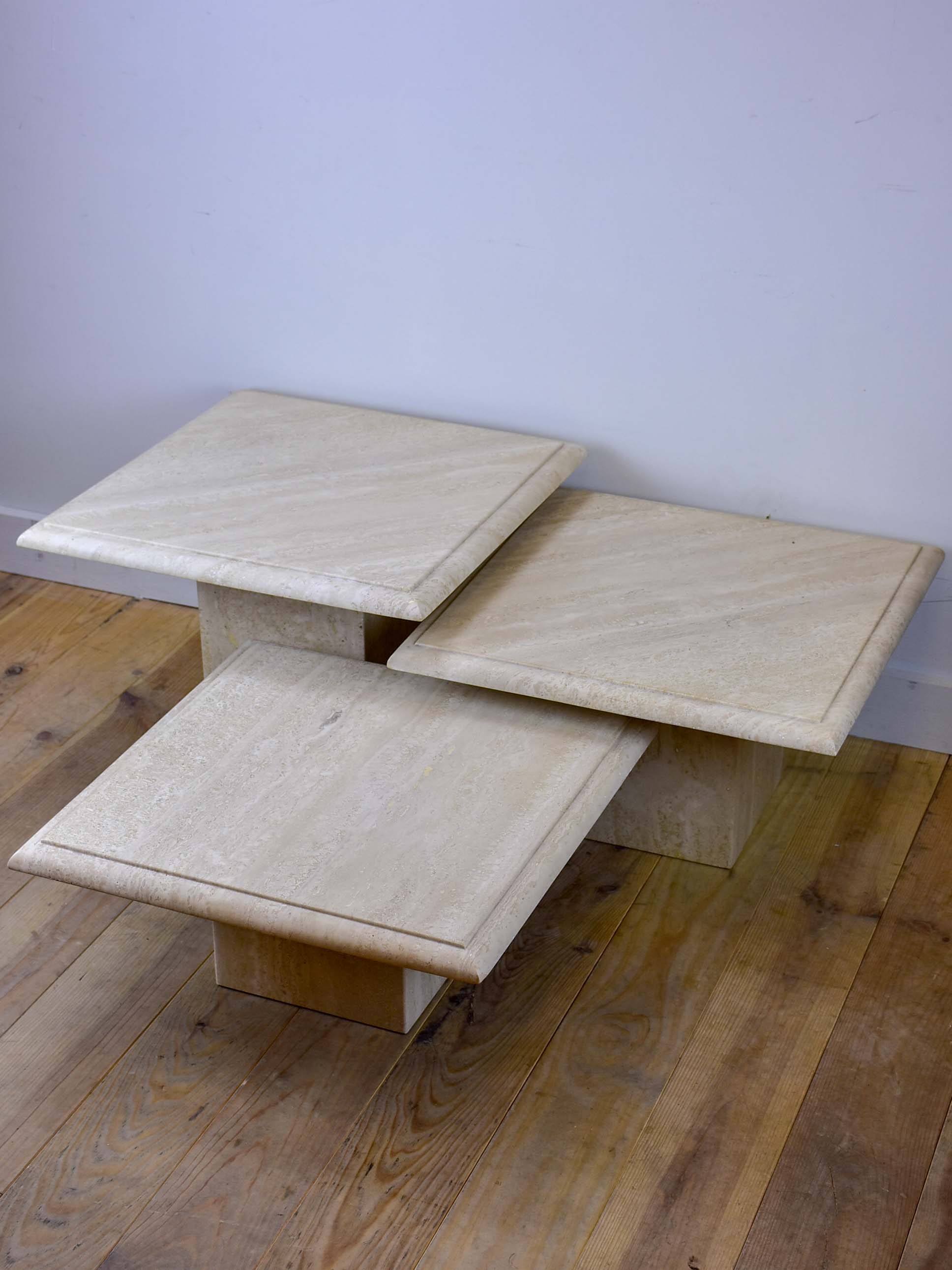 Three vintage travertine nesting side tables