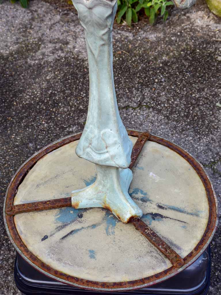 Art Nouveau cast iron bistro table with beige glass table top