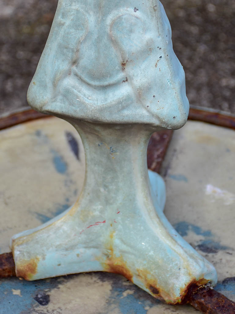 Art Nouveau cast iron bistro table with beige glass table top