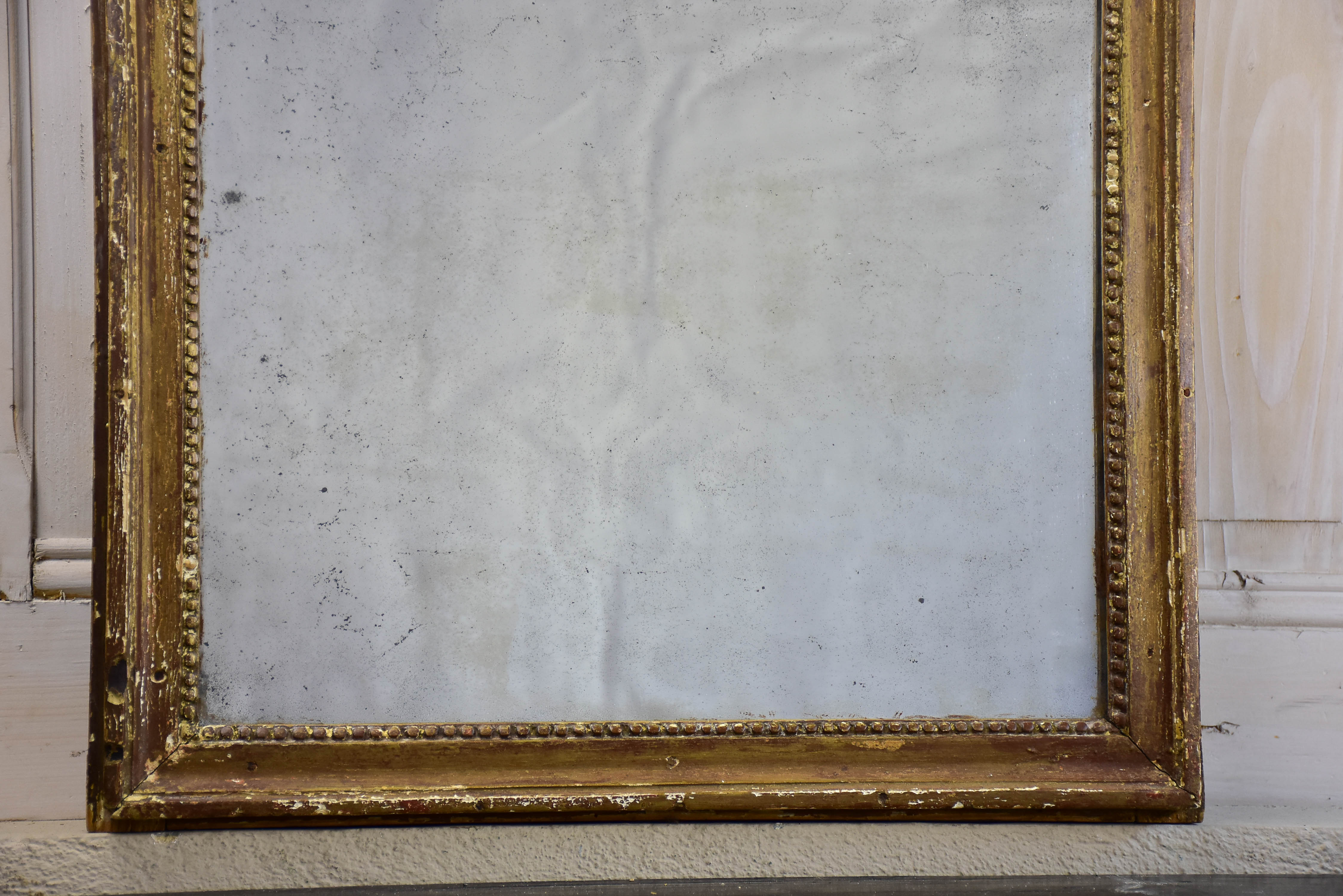 Rustic Louis XVI mirror with gilded frame 20” x 25 ½''