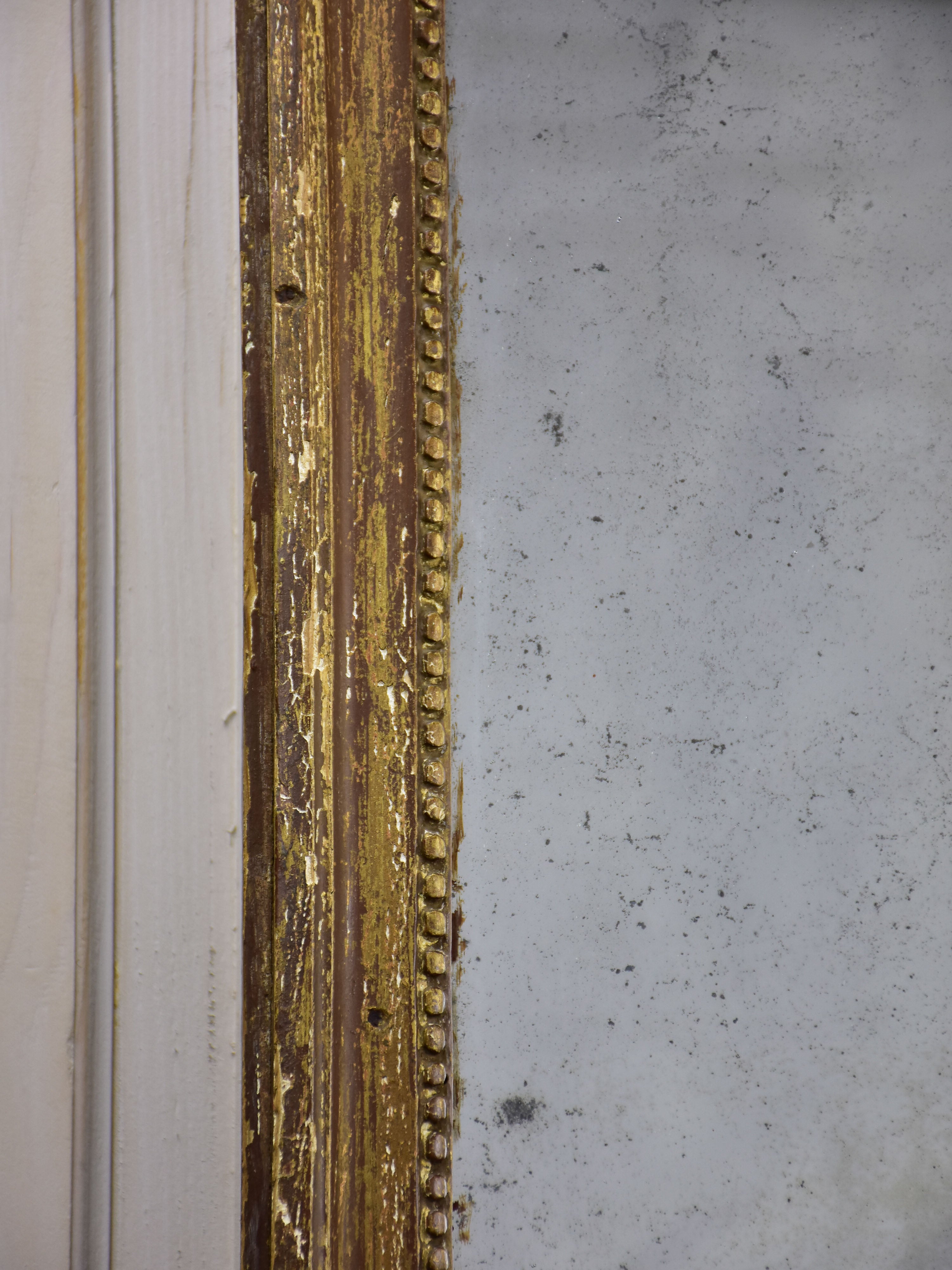 Rustic Louis XVI mirror with gilded frame 20” x 25 ½''