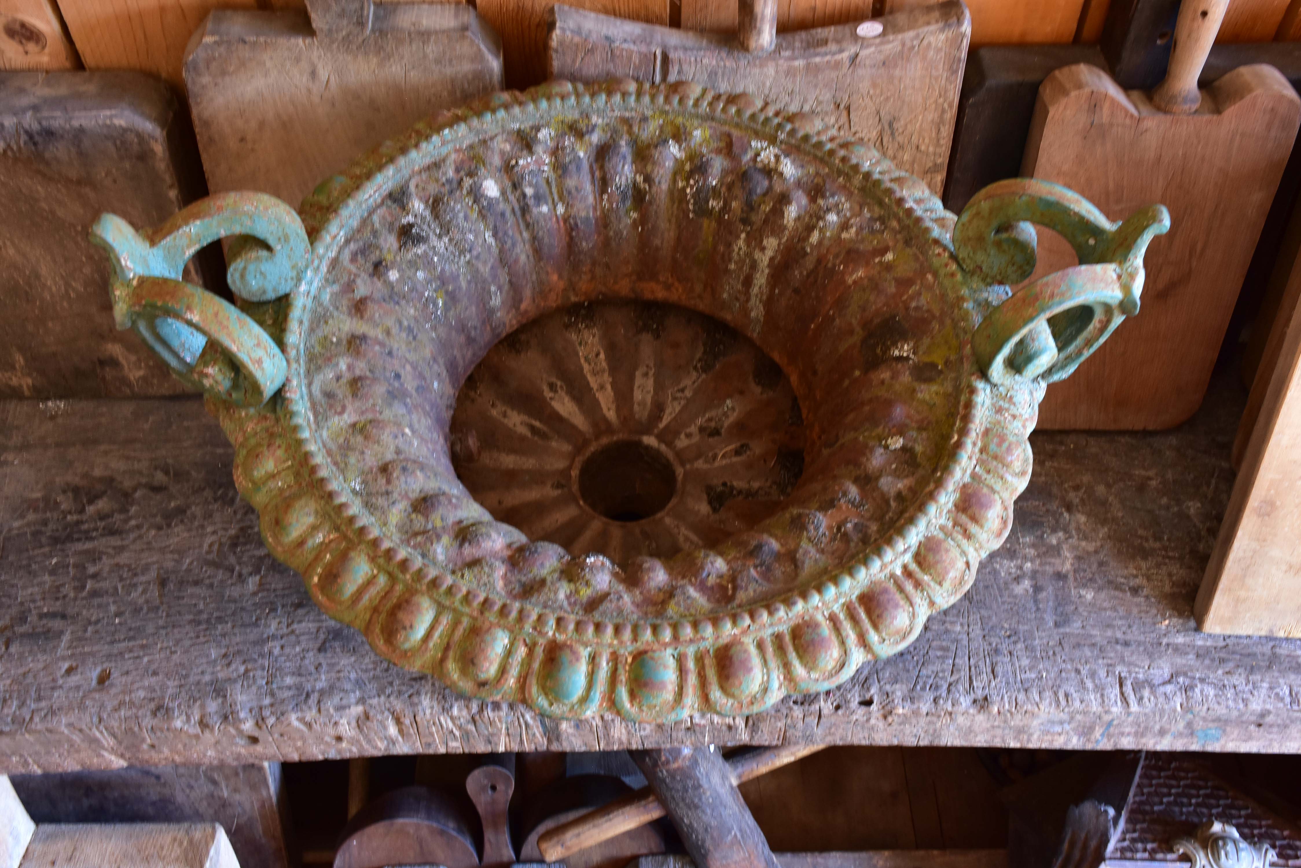 Late 19th century Chambord garden urn with green patina and decorative handles