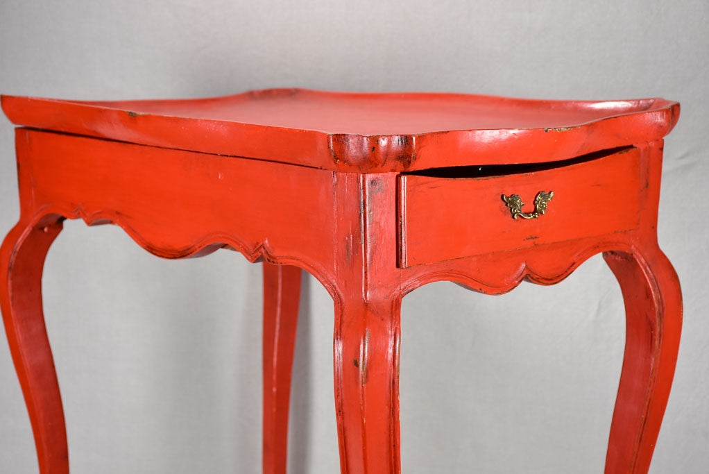 Louis XV table with side draw and red paint finish