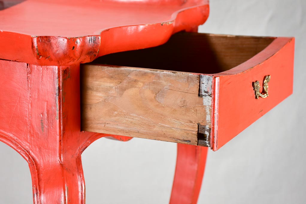 Louis XV table with side draw and red paint finish