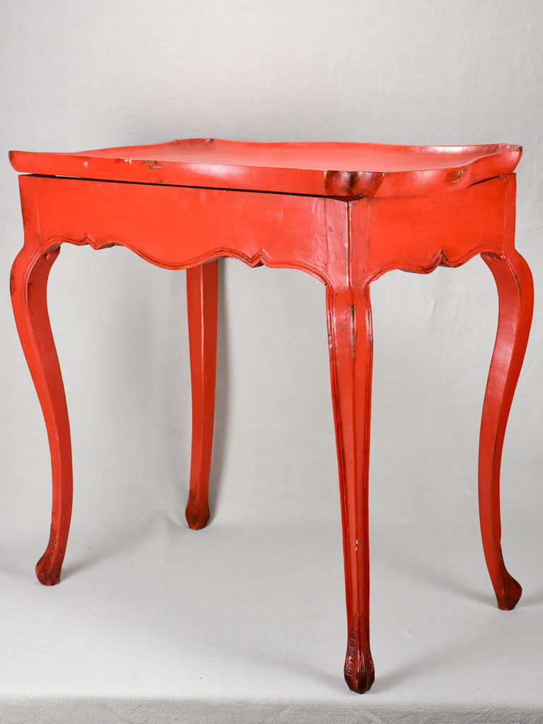 Louis XV table with side draw and red paint finish