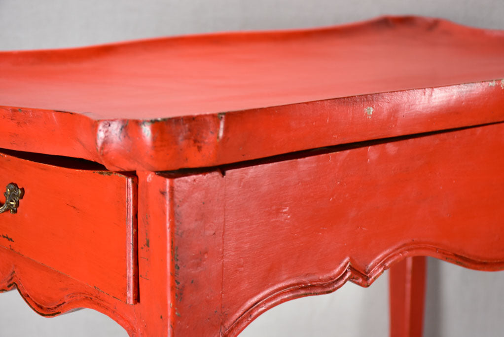 Louis XV table with side draw and red paint finish