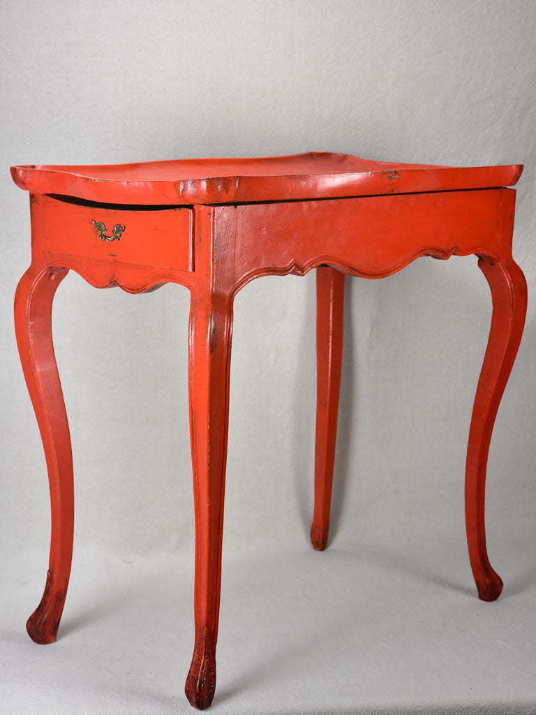 Louis XV table with side draw and red paint finish