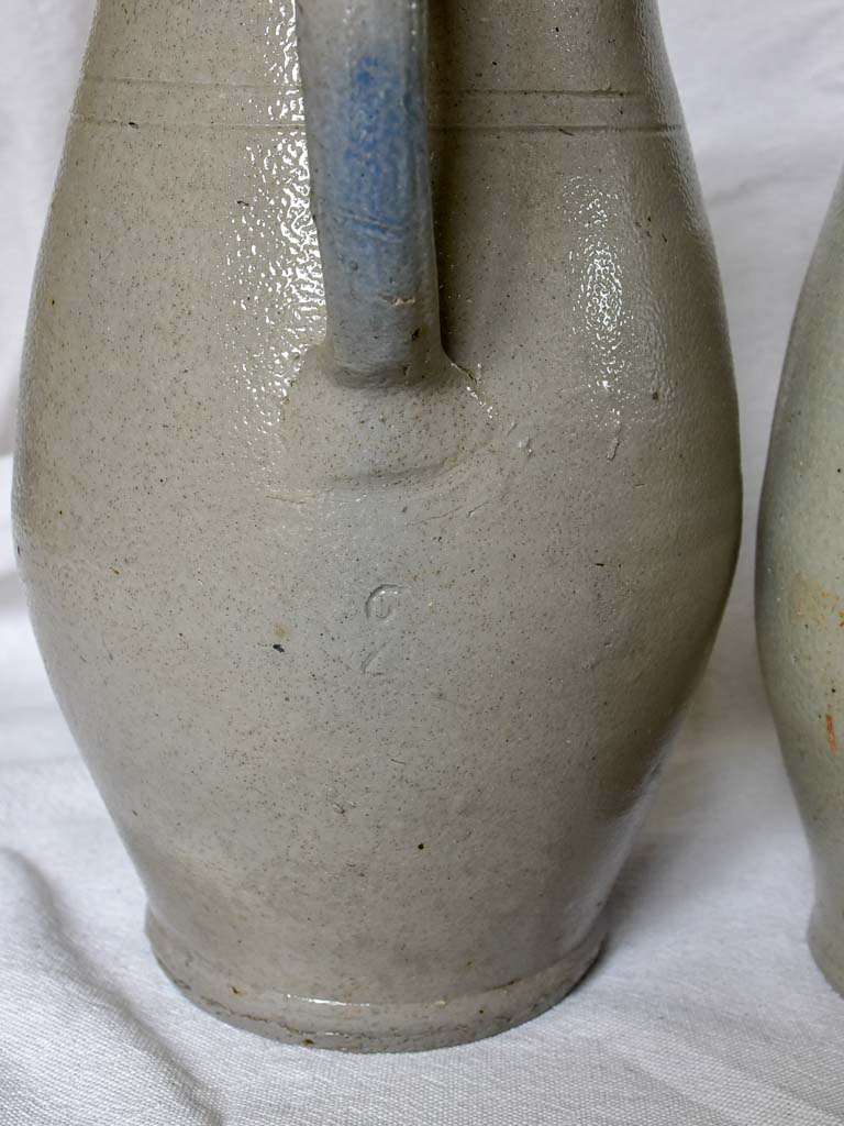 Two antique French milk pitchers - gray sandstone