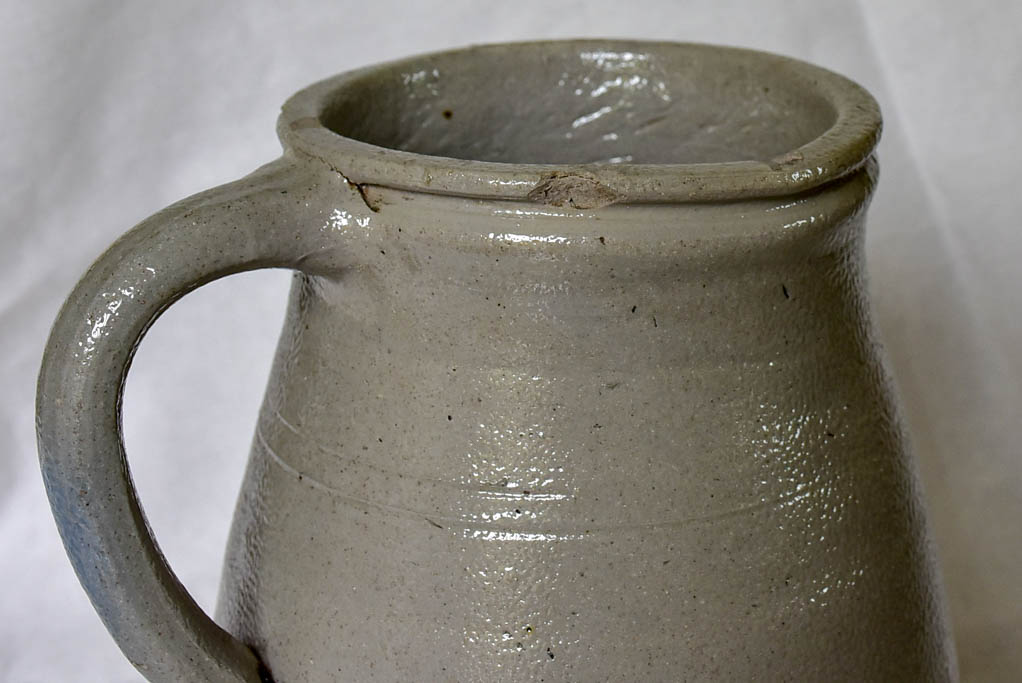 Two antique French milk pitchers - gray sandstone