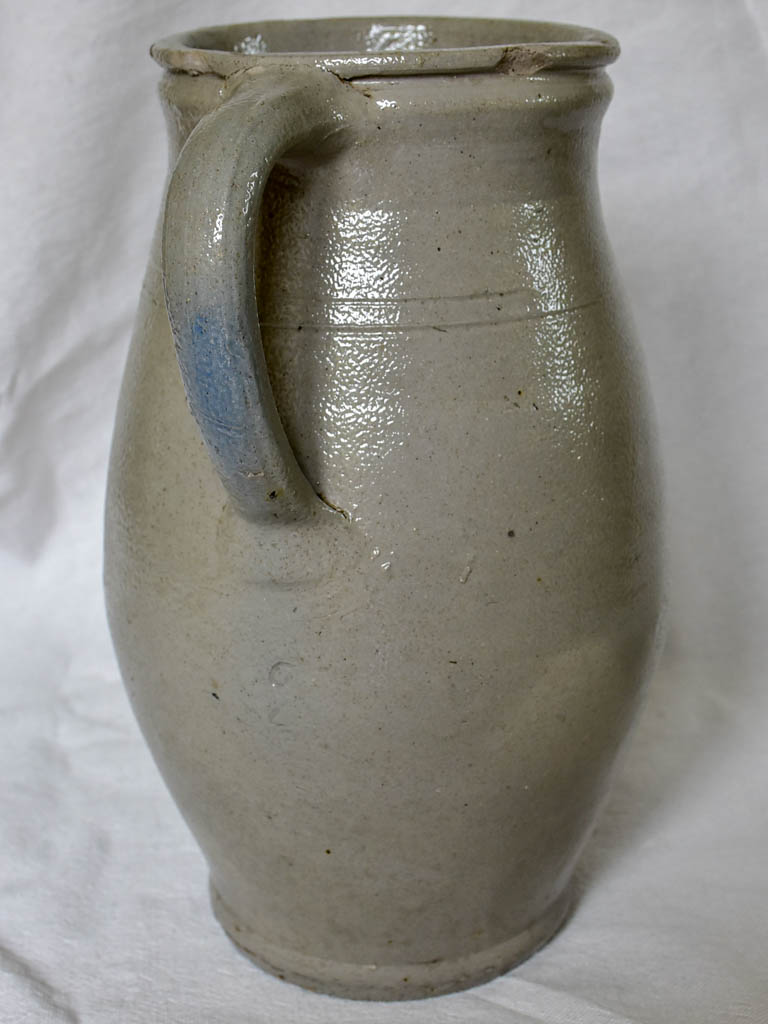 Two antique French milk pitchers - gray sandstone