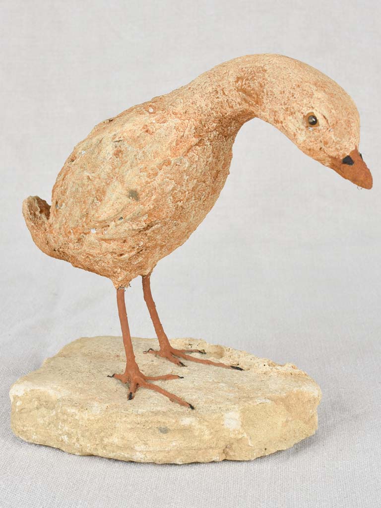 Artisan-made sculpture of a bird on a rock 8¾"