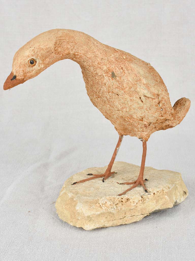 Artisan-made sculpture of a bird on a rock 8¾"