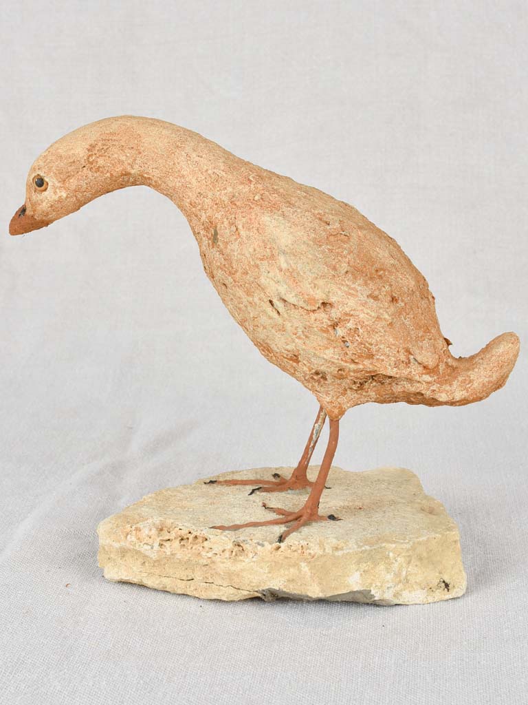 Artisan-made sculpture of a bird on a rock 8¾"