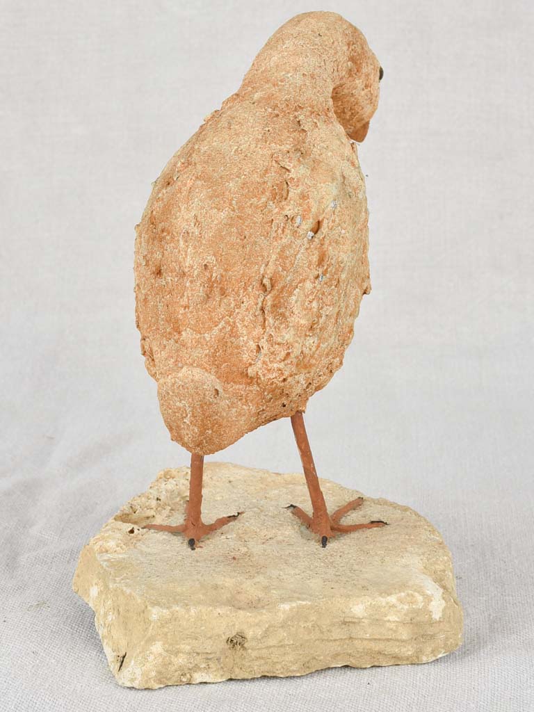 Artisan-made sculpture of a bird on a rock 8¾"