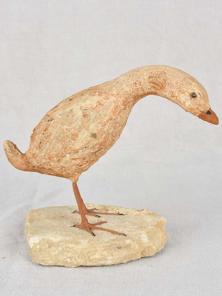 Artisan-made sculpture of a bird on a rock 8¾"