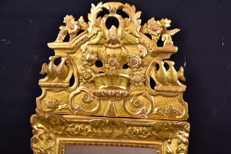 19th century Louis XV style gilded mirror with pediment