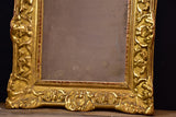 19th century Louis XV style gilded mirror with pediment