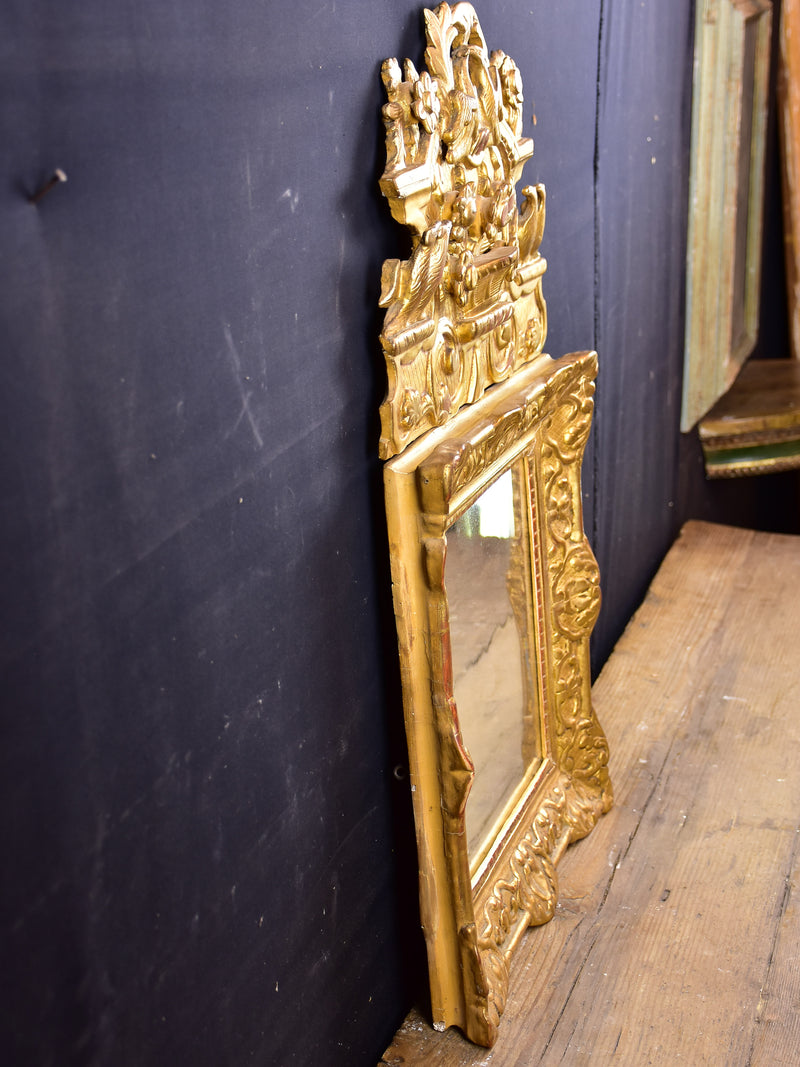 19th century Louis XV style gilded mirror with pediment