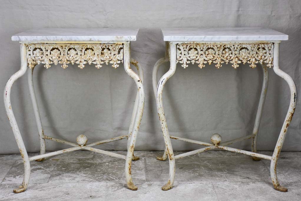 Pair of white cast iron and Carrara marble side tables