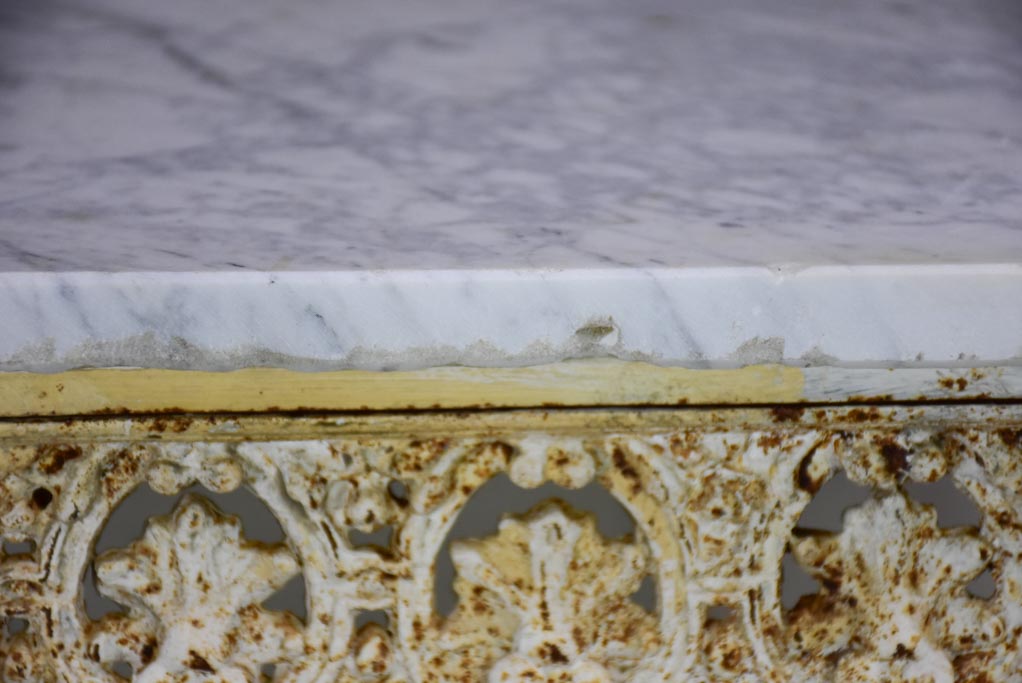 Pair of white cast iron and Carrara marble side tables