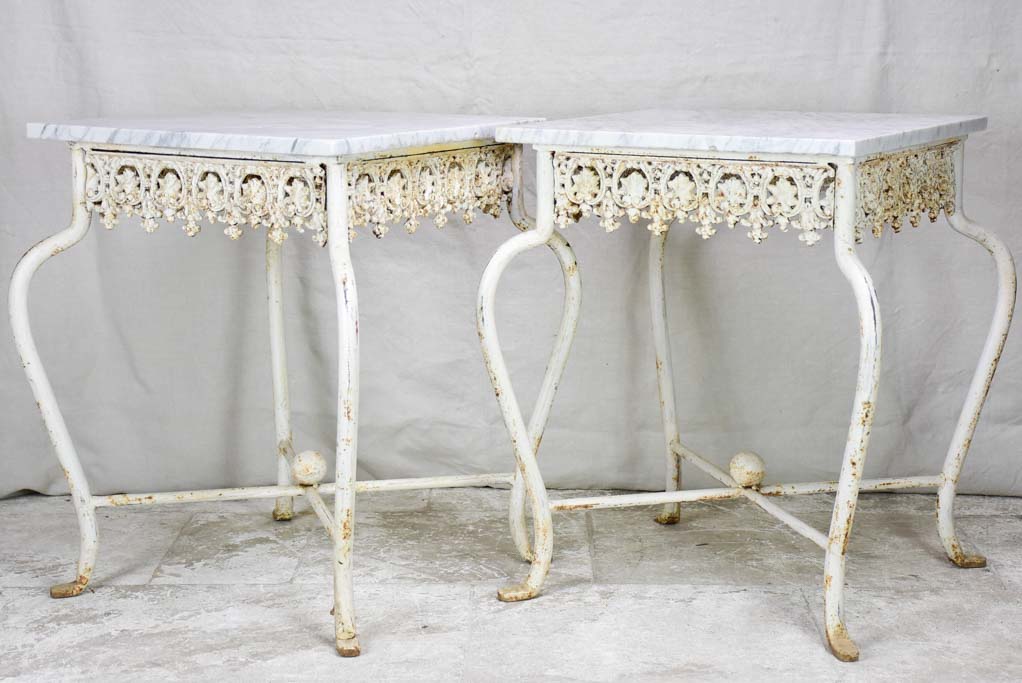 Pair of white cast iron and Carrara marble side tables