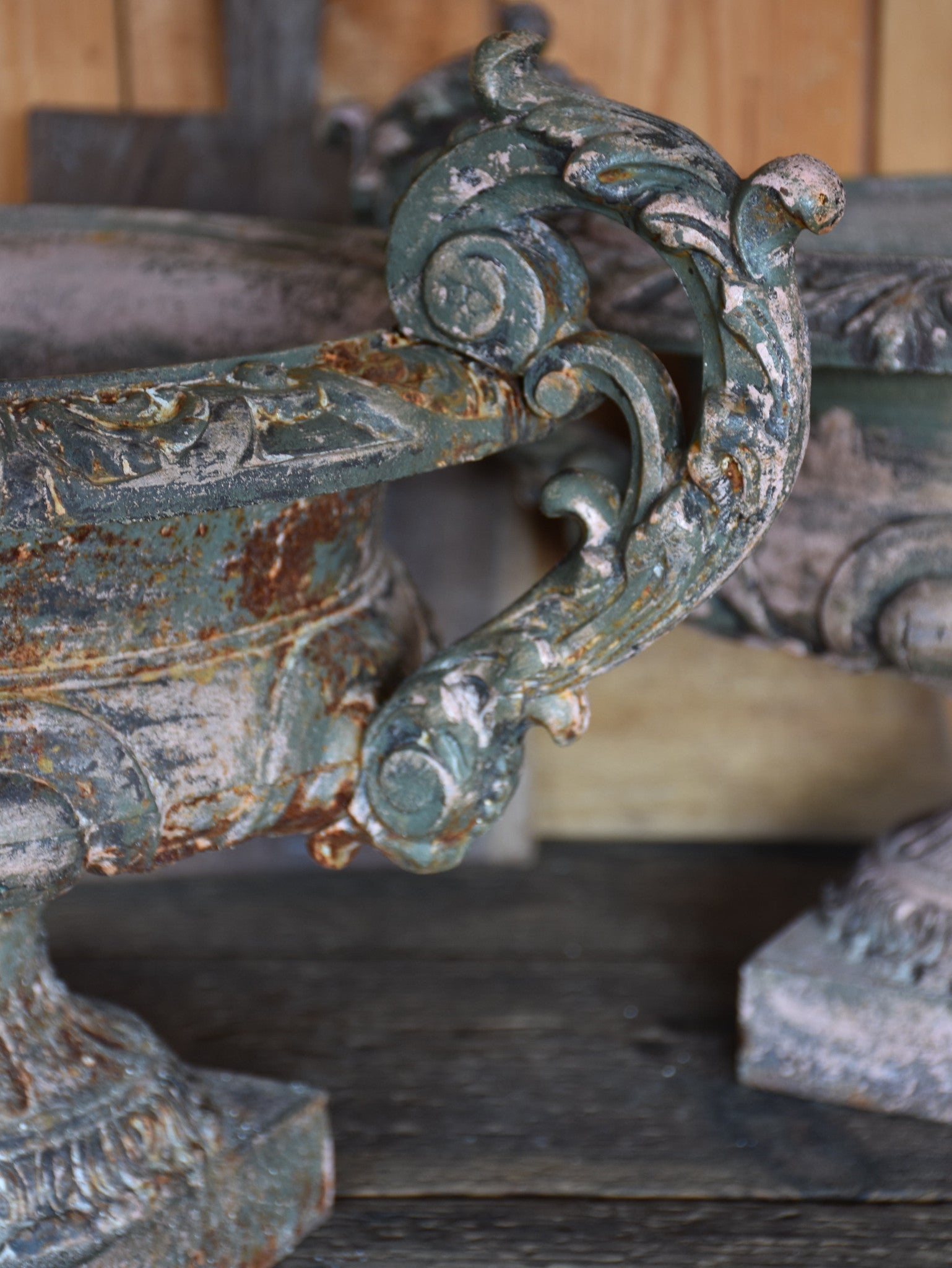 Pair of antique Medici urns with green / pink patina