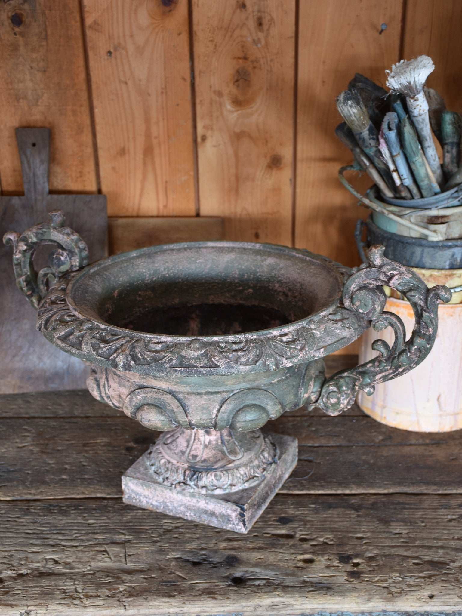 Pair of antique Medici urns with green / pink patina