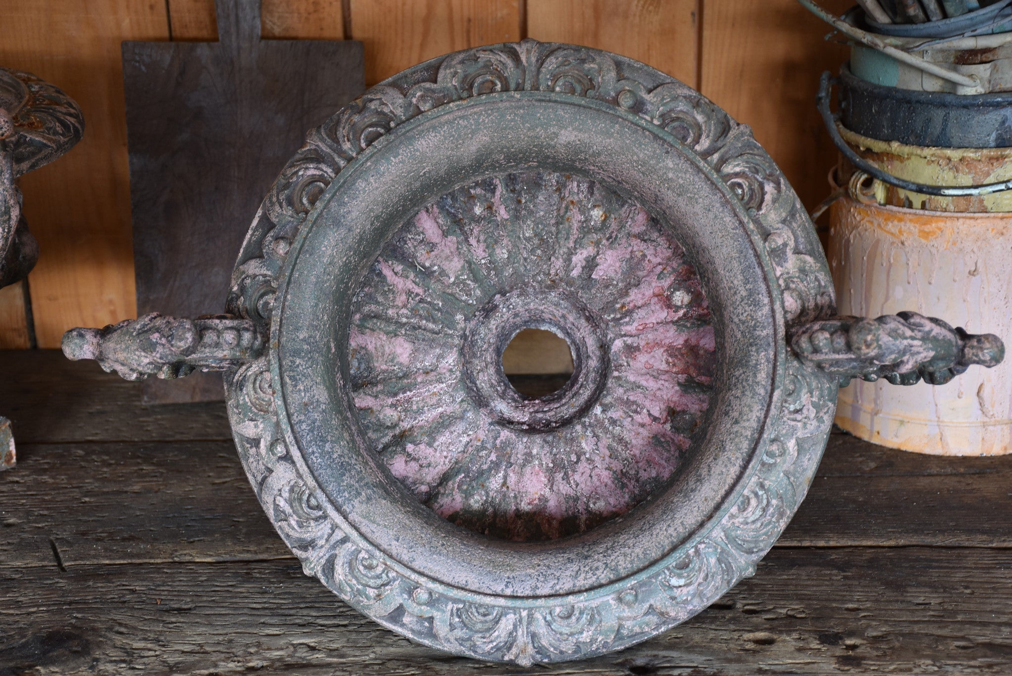 Pair of antique Medici urns with green / pink patina