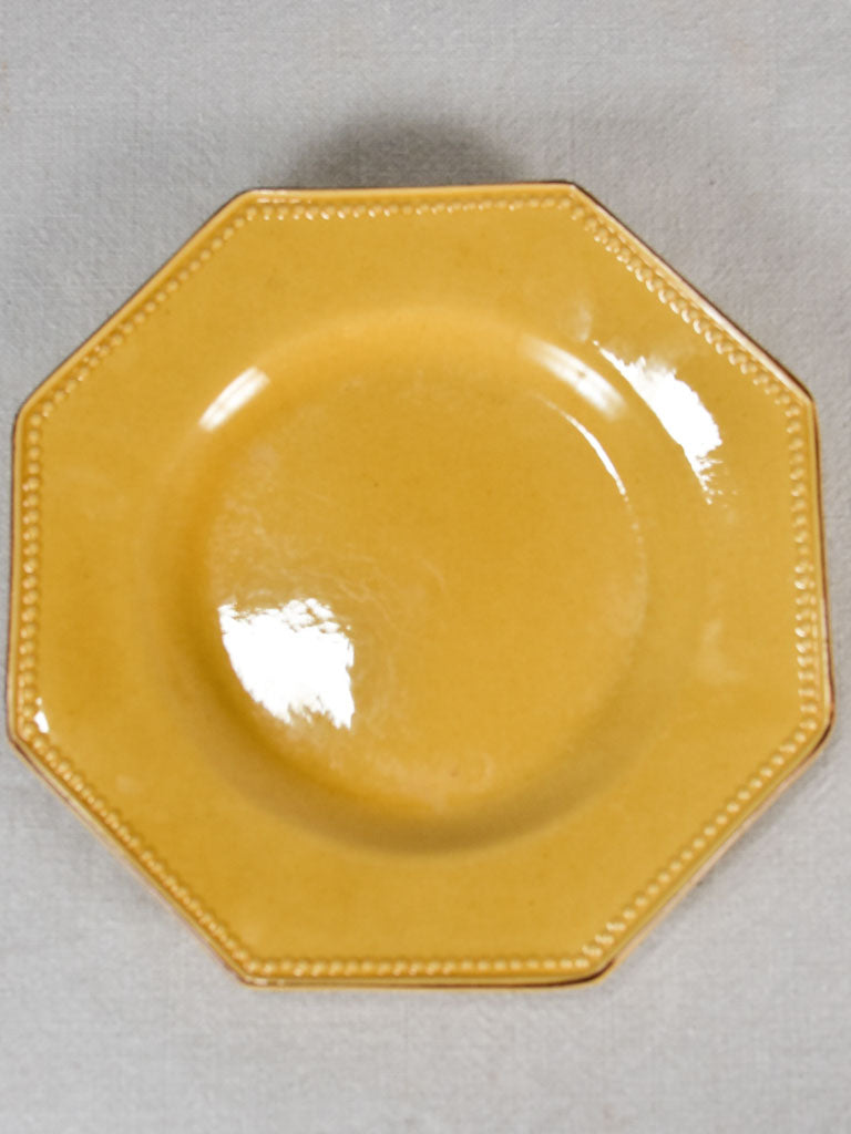 Collection of 12 octagonal plates with yellow ocher glaze 9½"