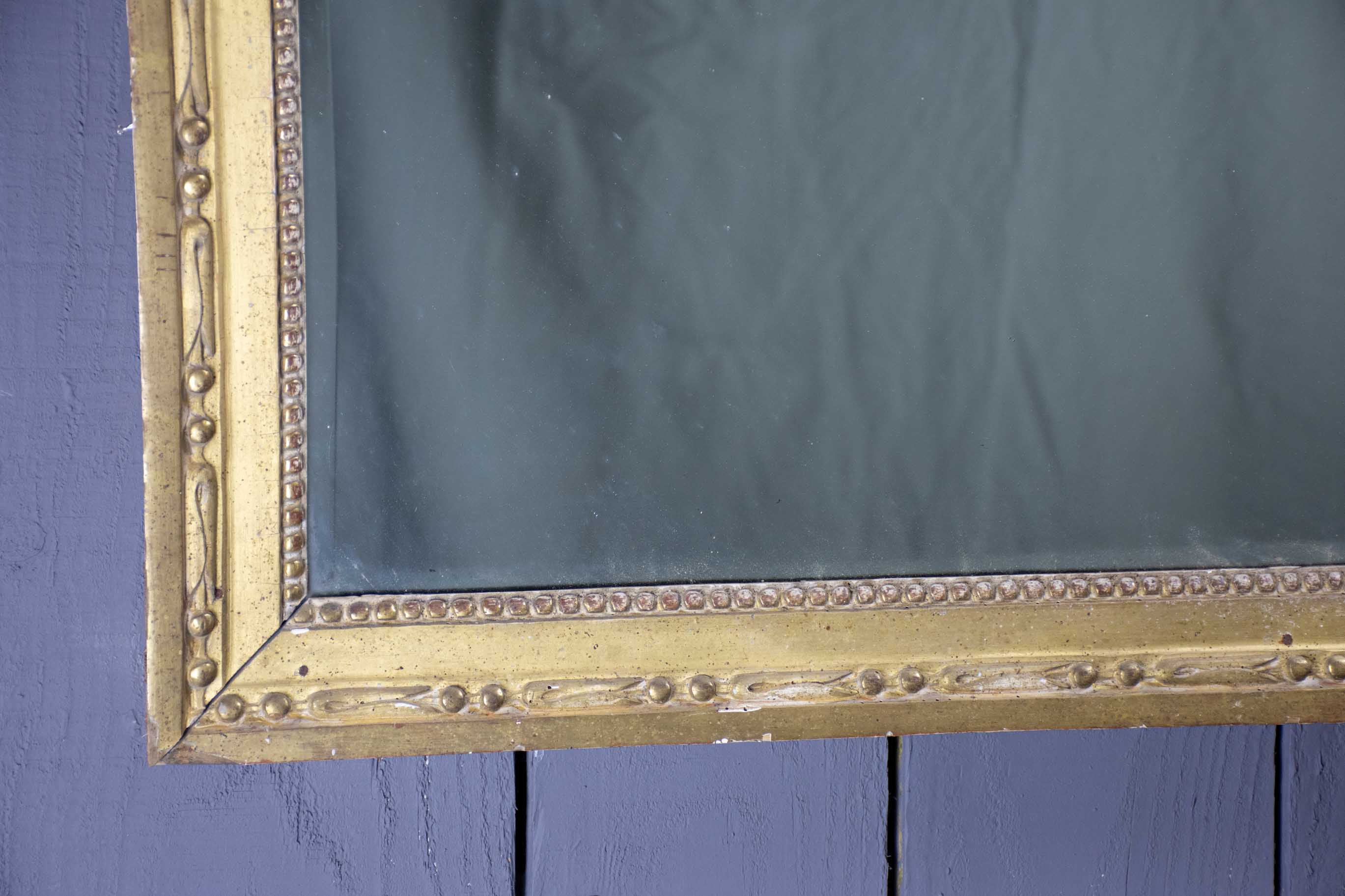 Louis XVI mirror with gilded frame and mercury glass