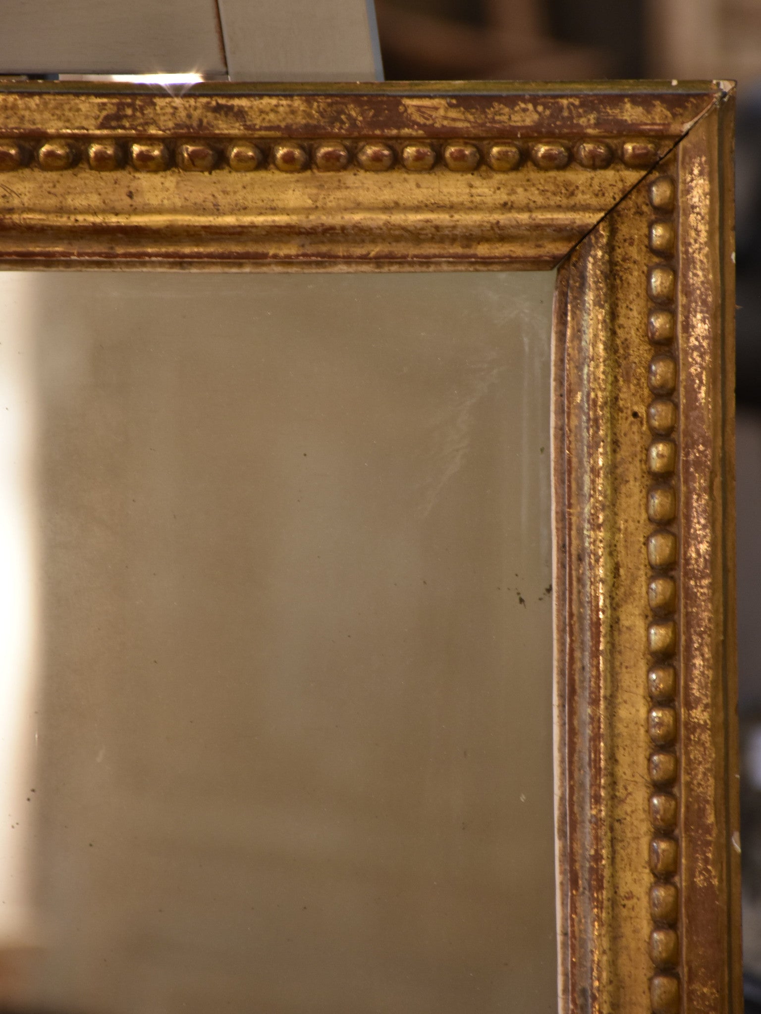 Petite early 19th century gilded French mirror