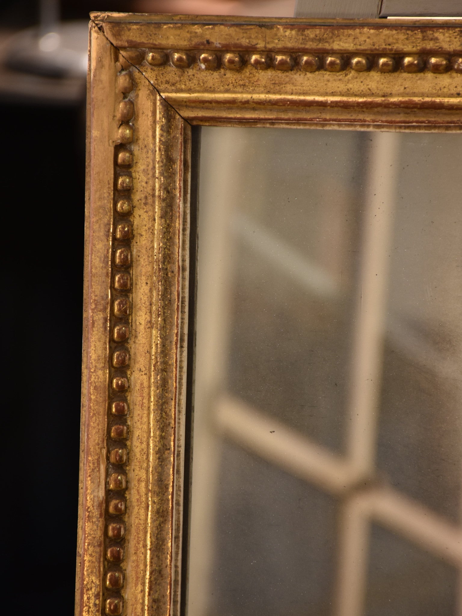 Petite early 19th century gilded French mirror