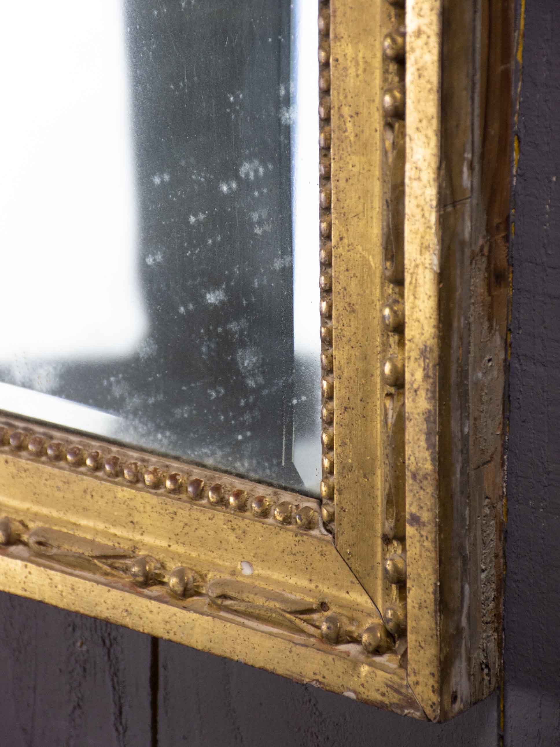 Louis XVI mirror with gilded frame and mercury glass